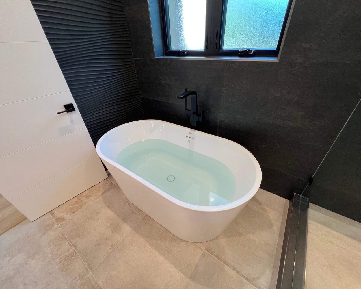 Custom bathtub and fixtures installed during a Bay Area bathroom renovation by Bay Area Design and Construction.