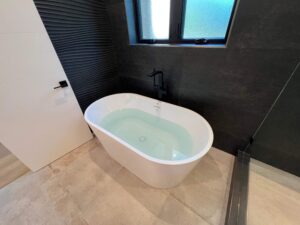 Custom bathtub and fixtures installed during a Bay Area bathroom renovation by Bay Area Design and Construction.