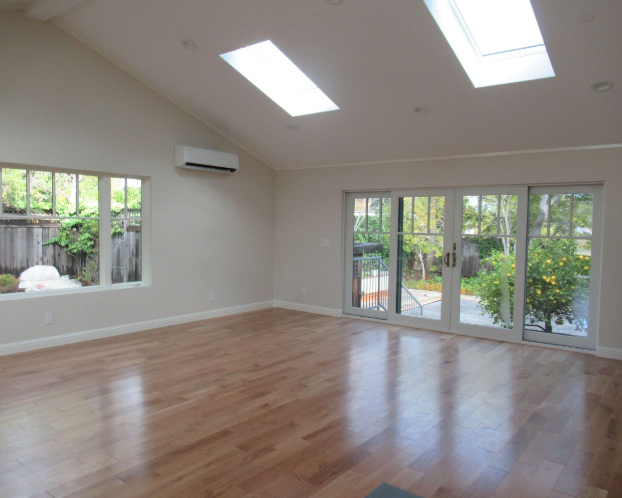 Remodeling contractors created bright lofted living space with skylights