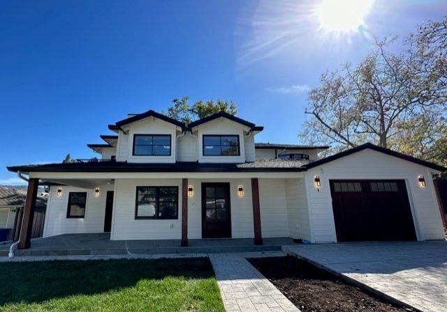 Vibrant white and brown trimmed home after remodel
